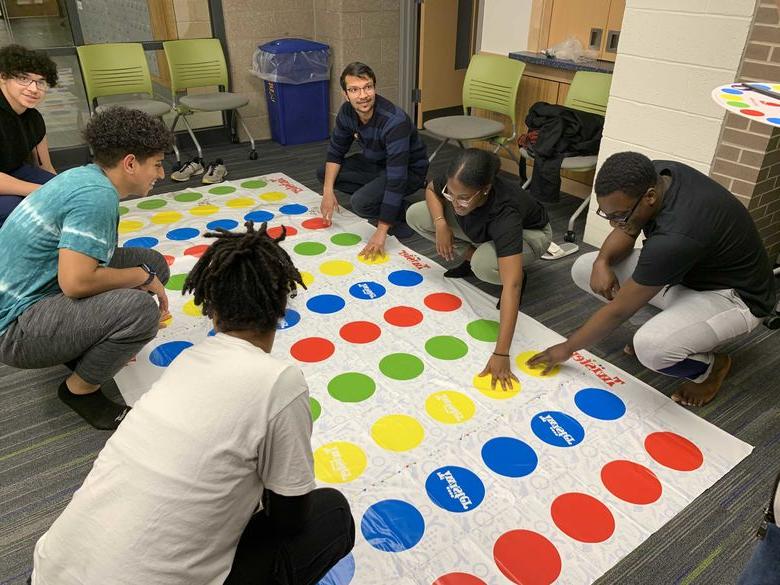 Student playing Twister in Penn State Abington Lions Gate near Philadelphia